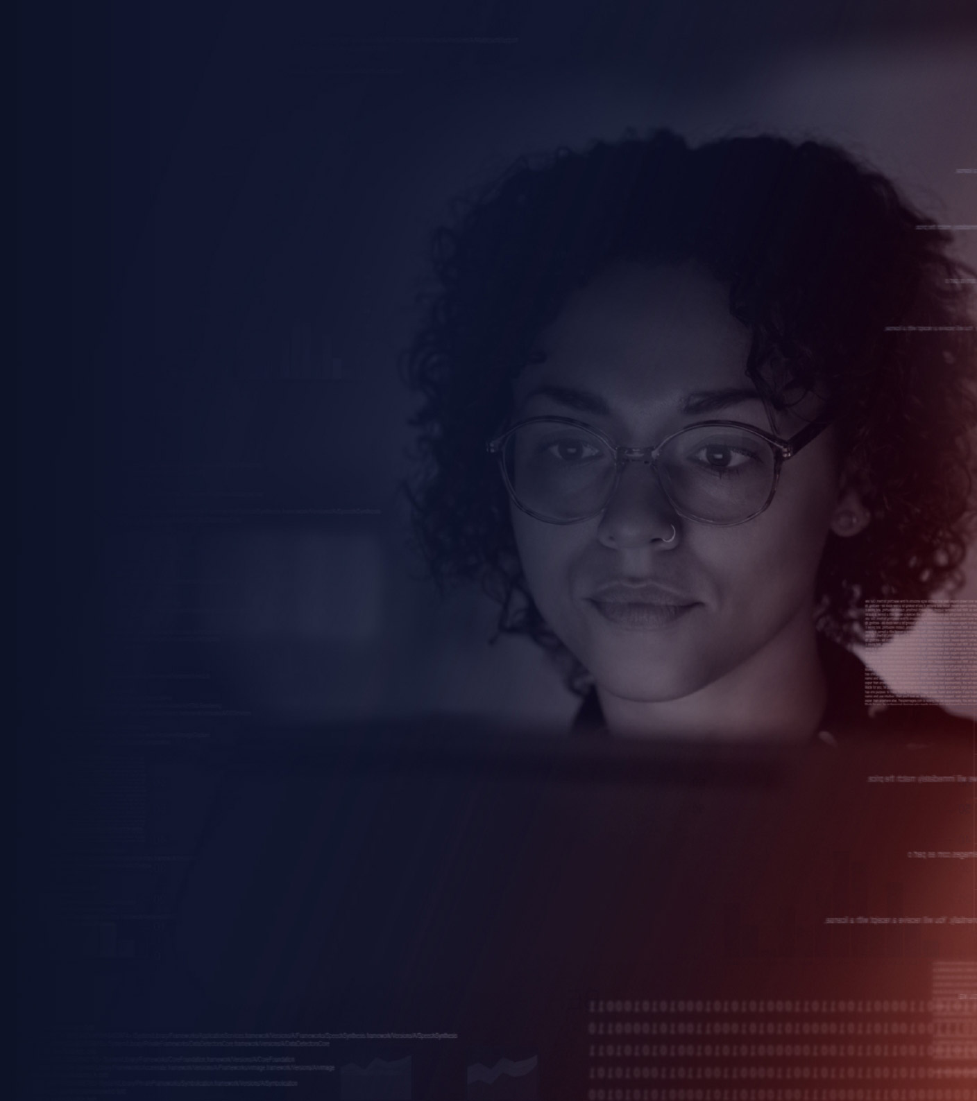 Woman wearing glasses looking at computer monitor