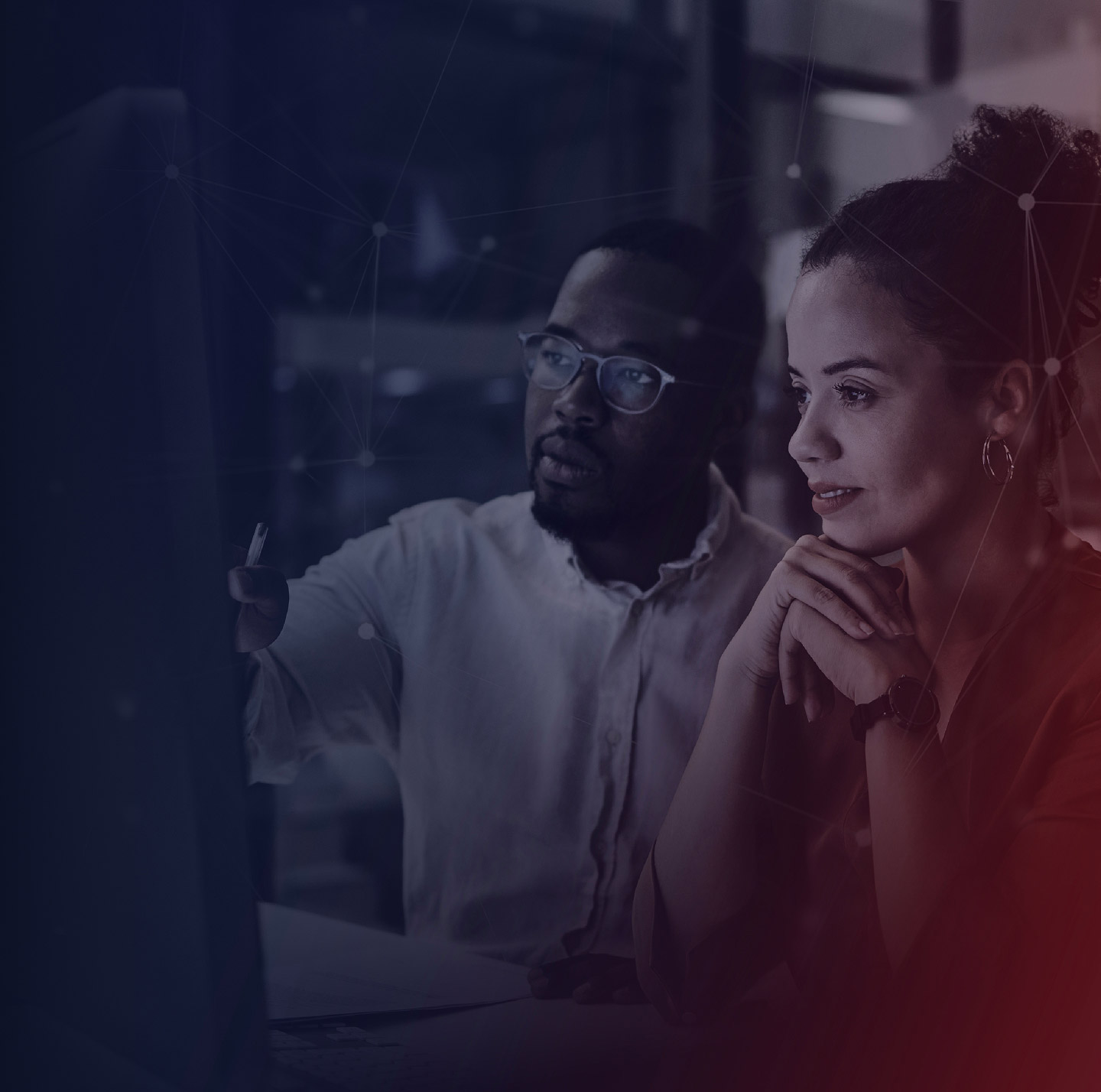 Man and woman looking at a computer monitor